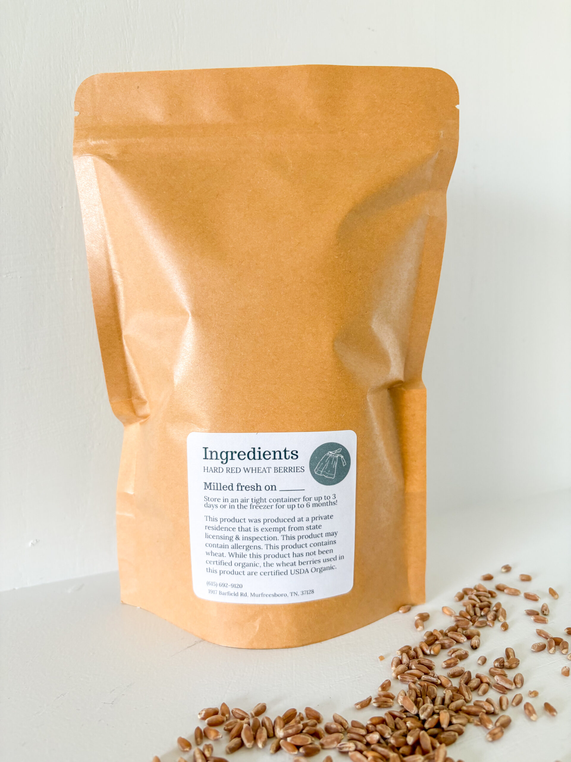 bag of freshly milled flour with a white background