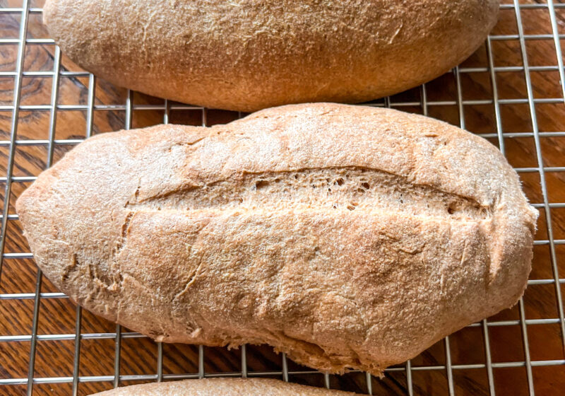 fresh milled hoagie rolls ona cooling rack